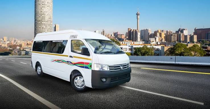 White minibus taxi with South African flag livery